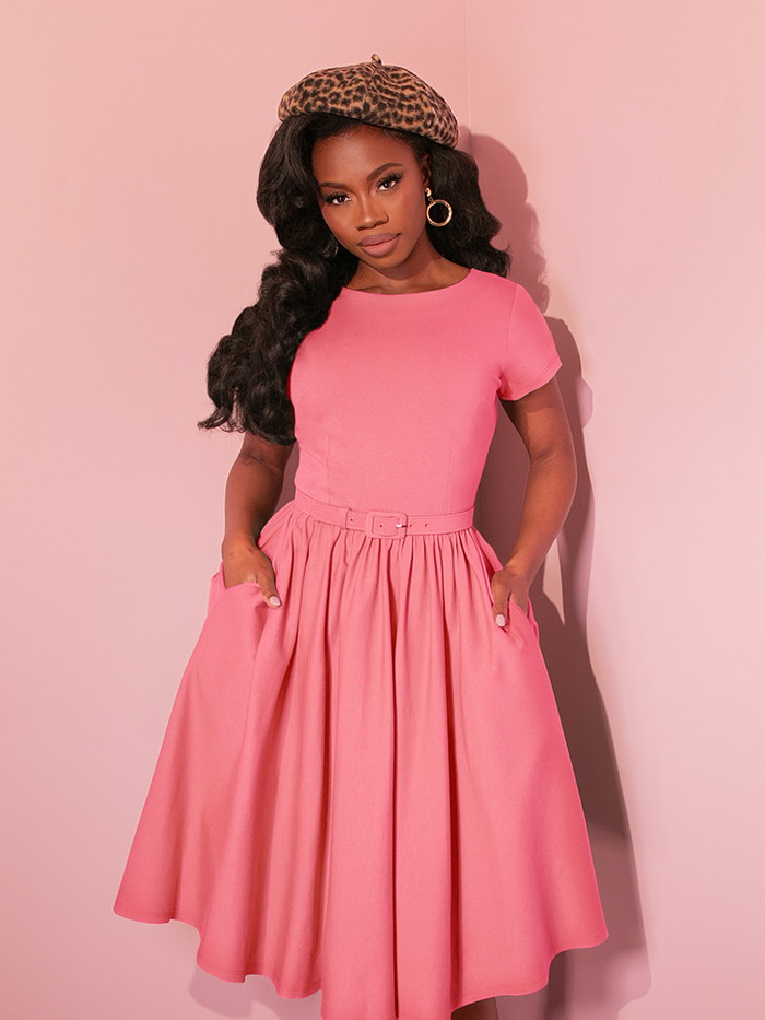 Channel classic Hollywood glamour in the Avon Swing Dress in Vixen Pink. With its flattering vintage-inspired silhouette, cinched waist, and full circle skirt, this dress is perfect for twirling the night away in timeless elegance.

