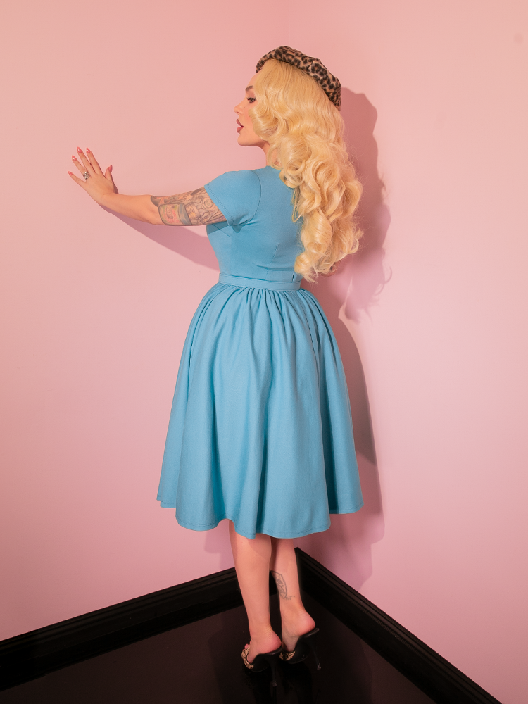 Step into old Hollywood elegance with the Avon Swing Dress in Sabrina Blue, designed to flatter with its tailored bodice and flowing skirt. This vintage-inspired dress is a must-have for creating effortlessly chic, timeless looks.