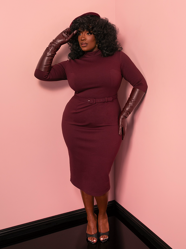 Radiate confidence in the Bad Girl Wiggle Dress, a merlot-hued vintage style dress that’s both daring and sophisticated. Its sleek design pays homage to Old Hollywood allure.