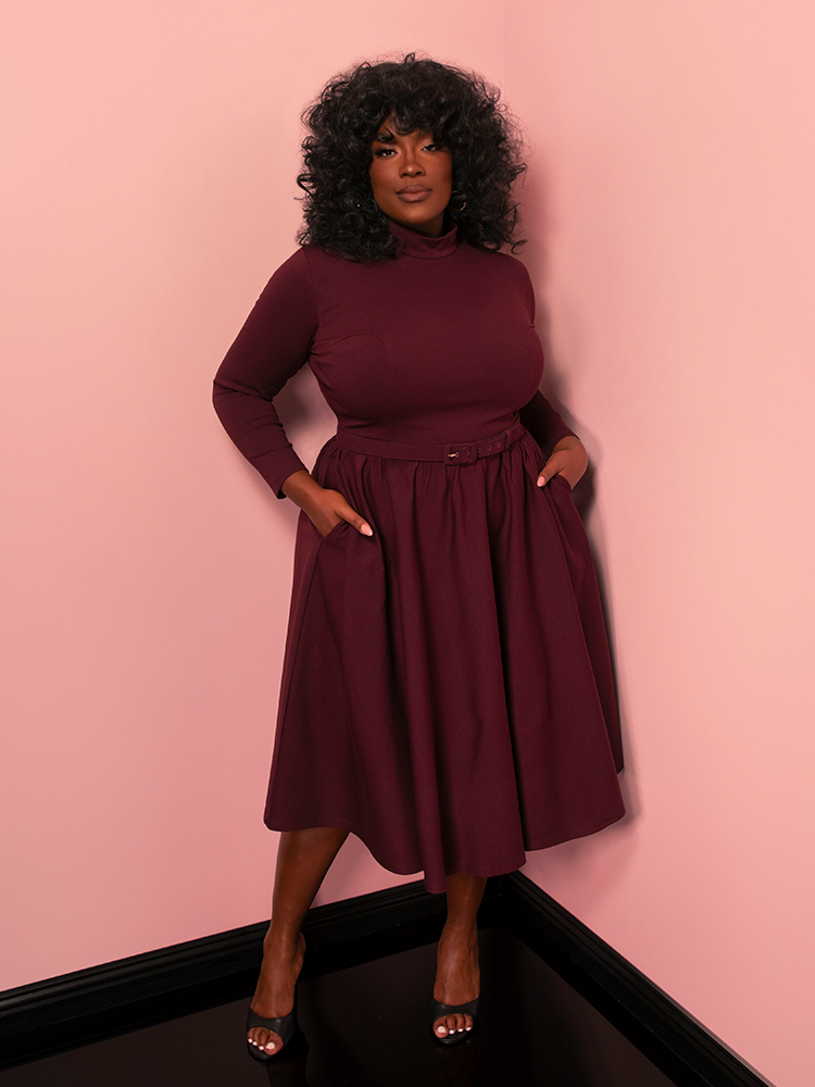 Radiate classic Hollywood glamour in the Bad Girl Swing Dress, a vintage style design in rich merlot. Its bold color and graceful swing skirt make it a standout choice for any special occasion.