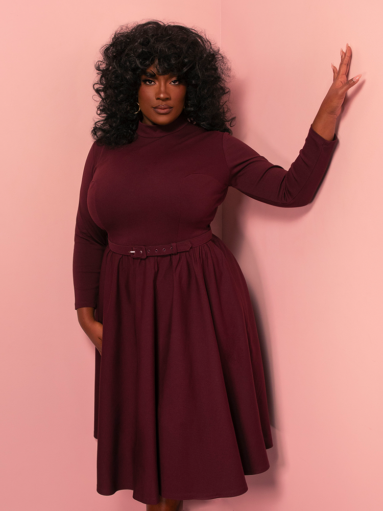 Command attention in the Bad Girl Swing Dress, a merlot-hued vintage-inspired dress with a flirty full skirt and classic Hollywood charm. Perfect for evening soirées and making bold entrances.