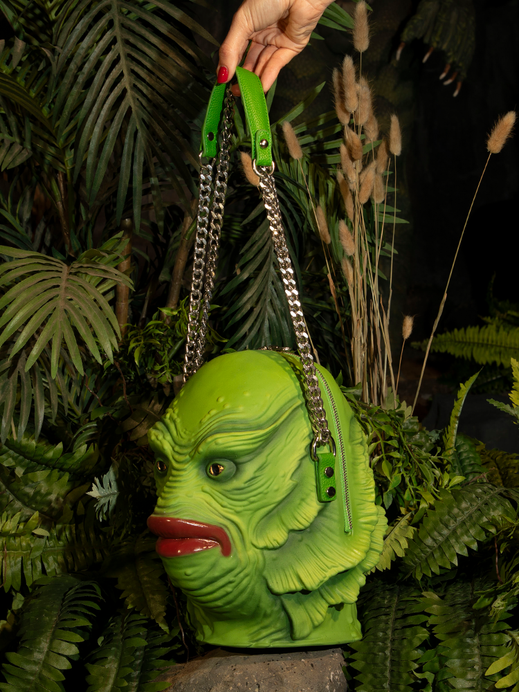 Enjoy the perfect blend of functionality and classic horror with the Creature from the Black Lagoon Monster Bag, a must-have accessory.