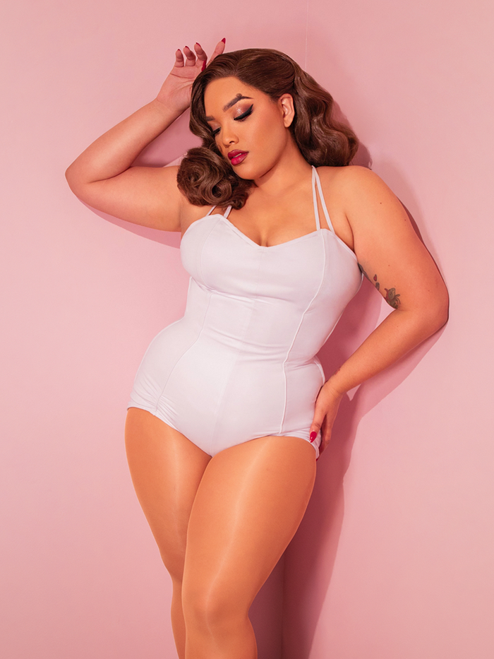 Dive into vintage horror style with the CREATURE FROM THE BLACK LAGOON™ Swimsuit in White. This timeless design captures the allure of classic Hollywood monsters with a sleek, vintage-inspired fit.