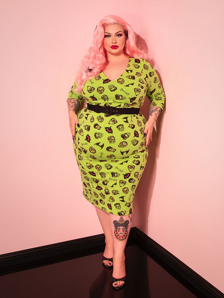 This vintage-inspired Deadly Wiggle Dress in Monster Mash Print combines classic pin-up glamour with a spooky, horror-themed aesthetic. With its sleek fit and bold print, it’s perfect for making a striking statement.