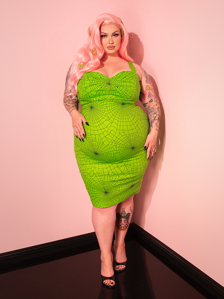 The Glamour Girl Dress in Slime combines a classic silhouette with a modern color twist, perfect for those who love vintage fashion with a bold edge.