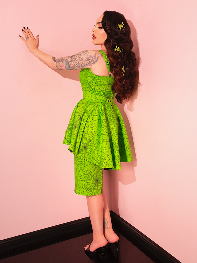 The Glamour Girl Dress in Slime captures the essence of retro chic, perfect for those who love to make a statement with vintage-inspired fashion.