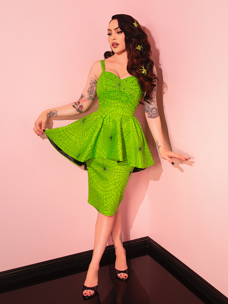 Channel your inner diva with the Glamour Girl Dress in Slime, a bold piece that blends vintage style with a modern twist.