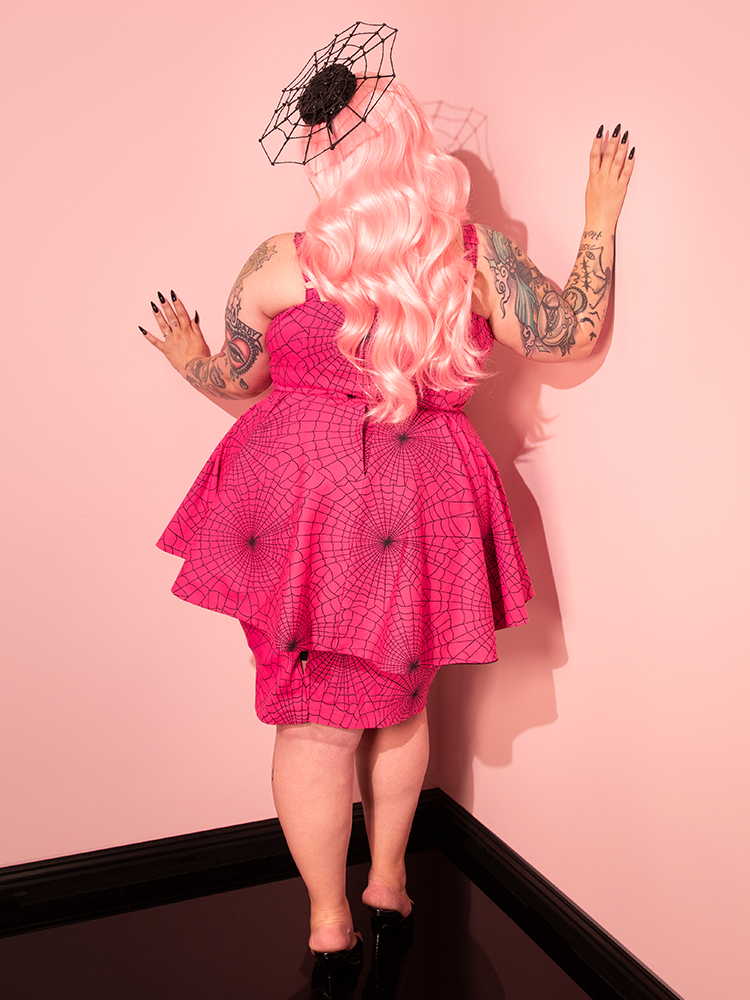 The Glamour Girl Pink Dress brings a pop of color and retro style to your look, perfect for making a statement at any event.