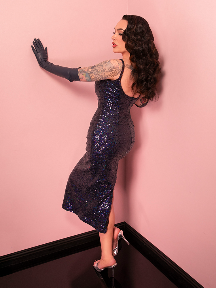 Elevate your evening look with the Glitz & Glamour Dress, a vintage-inspired masterpiece in navy sequins. Perfect for red-carpet moments or gala nights, it exudes timeless sophistication.