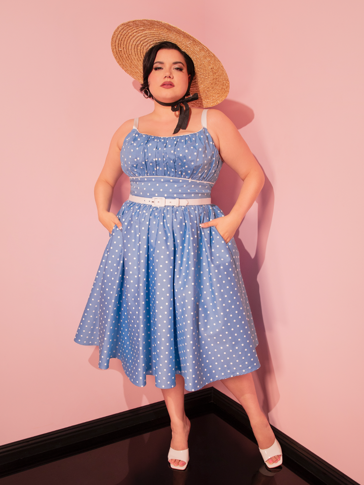 The Ingenue Swing Dress in Light Blue with White Polka Dots showcases a playful retro style, perfect for any vintage fashion lover.