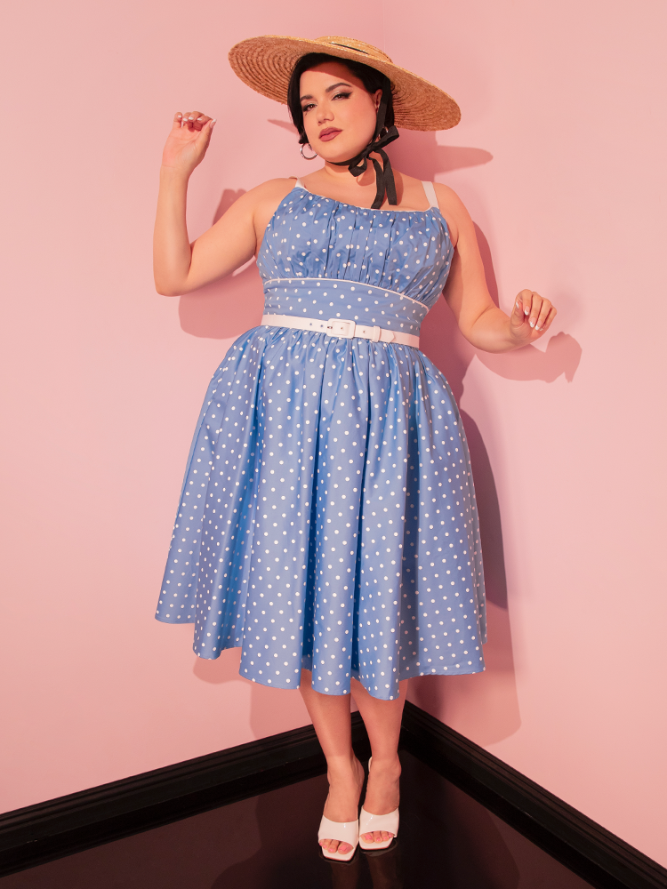 Make a stylish statement in the Ingenue Swing Dress in Light Blue with White Polka Dots, a retro-inspired dress that combines elegance with a touch of fun.