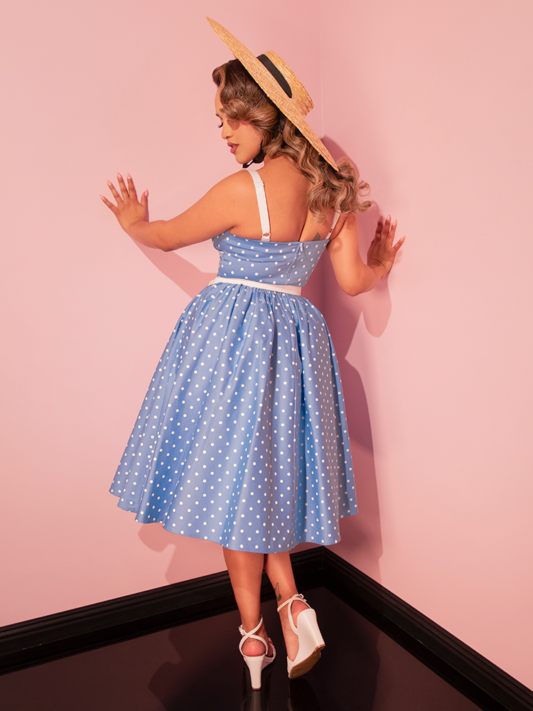 The Ingenue Swing Dress in Light Blue with White Polka Dots is your go-to retro-inspired dress, bringing a touch of classic fun to your wardrobe.