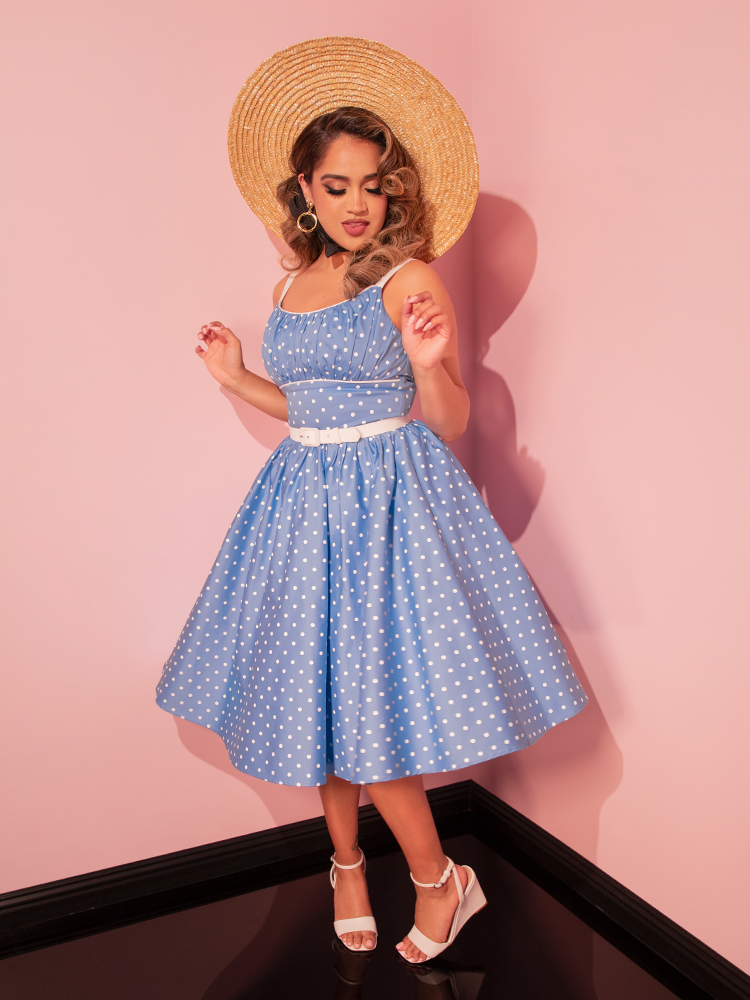 Step out in nostalgic style with the Ingenue Swing Dress in Light Blue with White Polka Dots, a retro dress that combines whimsy and sophistication.