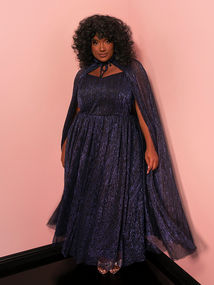 Inspired by timeless enchantment, this Jareth gown in midnight blue brings vintage drama to life.