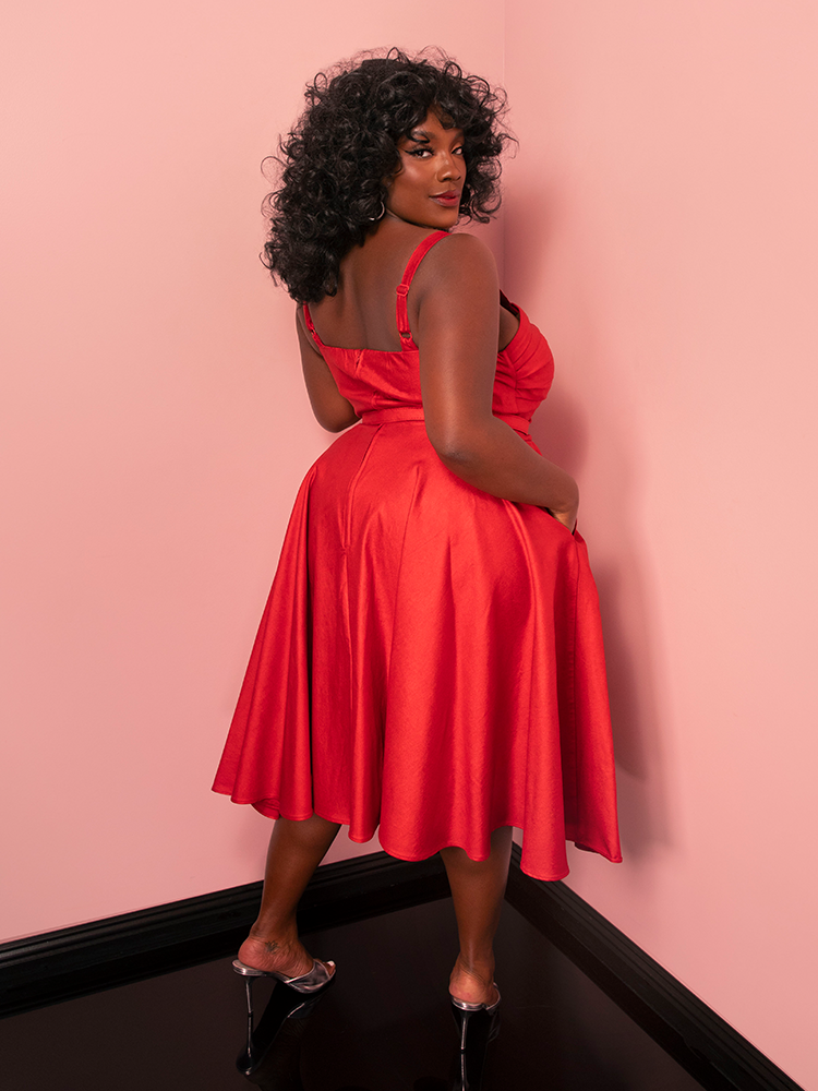 The Jawbreaker Swing Dress blends a bold red sparkle laminate with a classic silhouette, delivering effortless elegance straight out of the golden age.