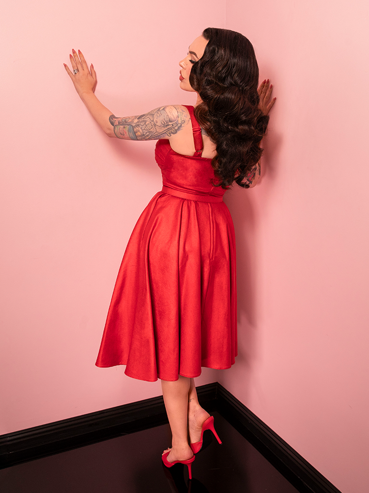 Featuring a striking red sparkle laminate, the Jawbreaker Swing Dress combines vintage charm with bold, contemporary flair for a truly memorable look.