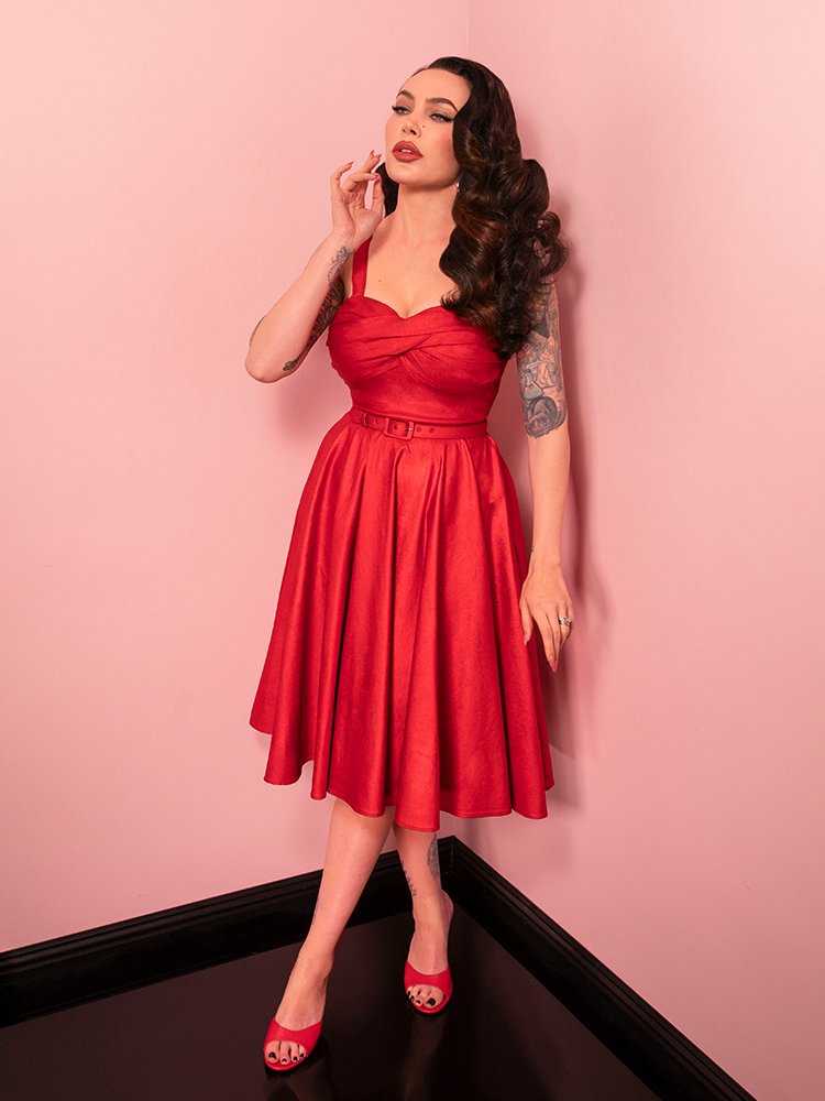 Step into the spotlight with the Jawbreaker Swing Dress in red sparkle laminate, a stunning choice for retro enthusiasts and modern style seekers alike.