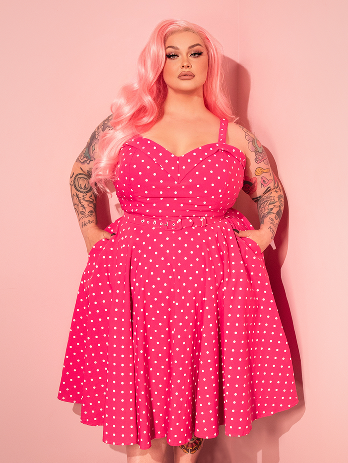 Step into classic Hollywood glamour with the Maneater Pink Polka Dot Swing Dress, featuring a playful print and a retro silhouette that’s perfect for twirling.