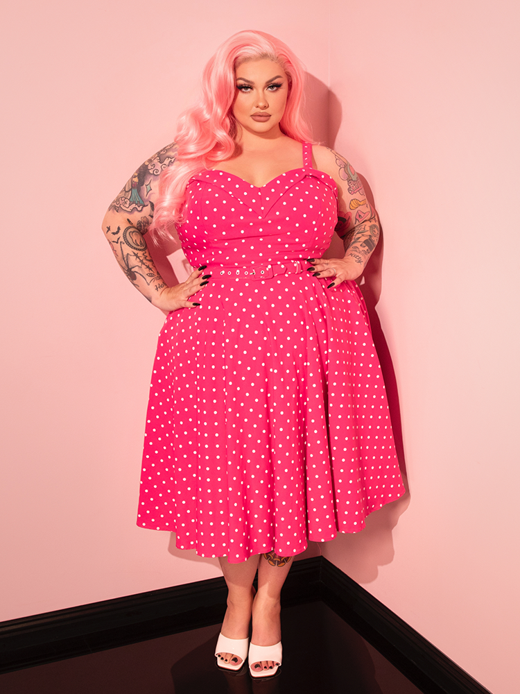 Channel your inner vintage vixen in the Maneater Pink Polka Dot Swing Dress, a flirty and fun piece that’s sure to make a statement.