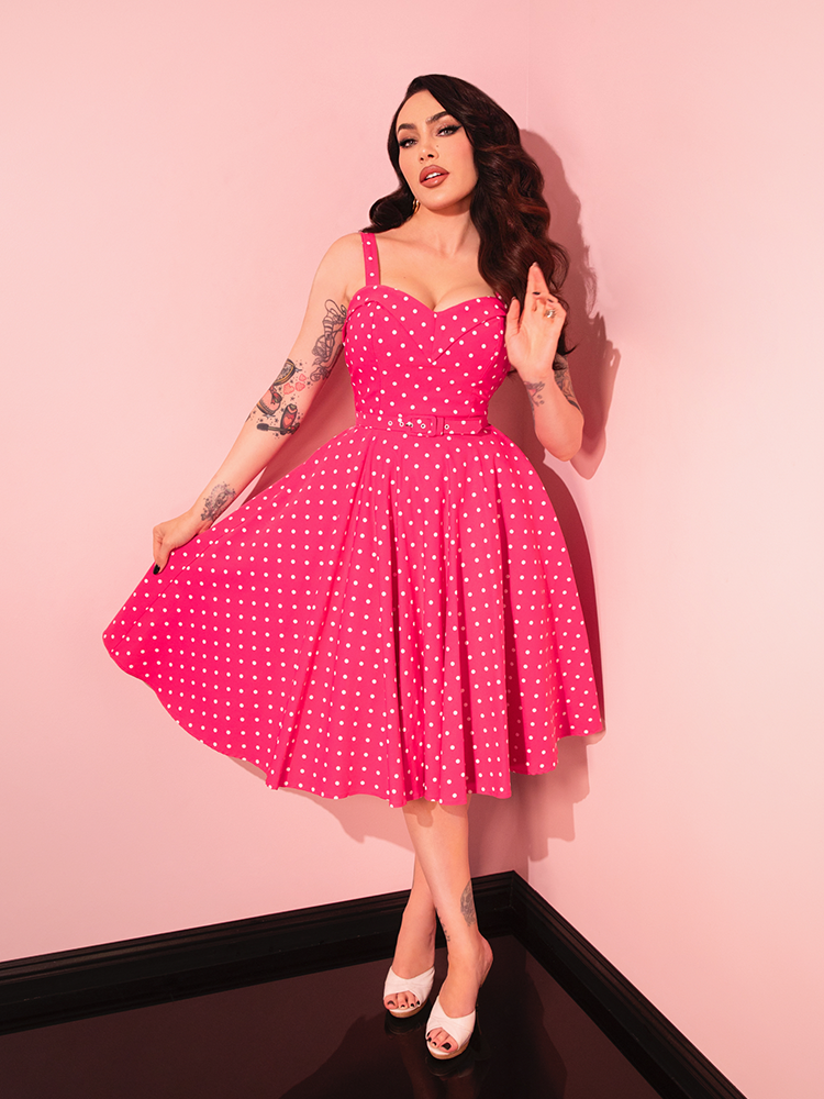 Step back in time with the Maneater Pink Polka Dot Swing Dress, a must-have for any vintage lover’s wardrobe, perfect for parties or casual outings.