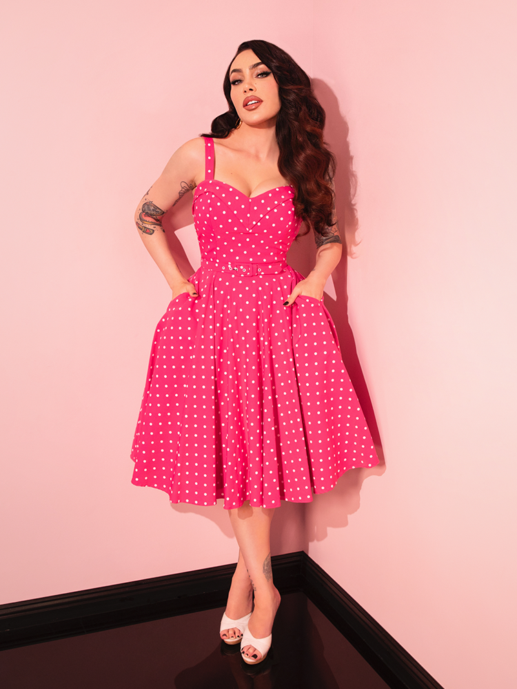 Make a statement in the Maneater Pink Polka Dot Swing Dress, where retro design meets modern sensibility, perfect for vintage-inspired style.