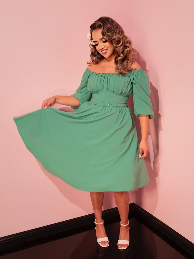 Keep it classy on your getaway with our moss green vacation dress, perfect for a touch of retro glamour.