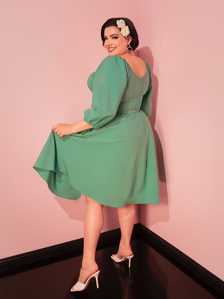 Enjoy effortless style and comfort on your travels with this moss green vacation dress, perfect for a chic retro look.