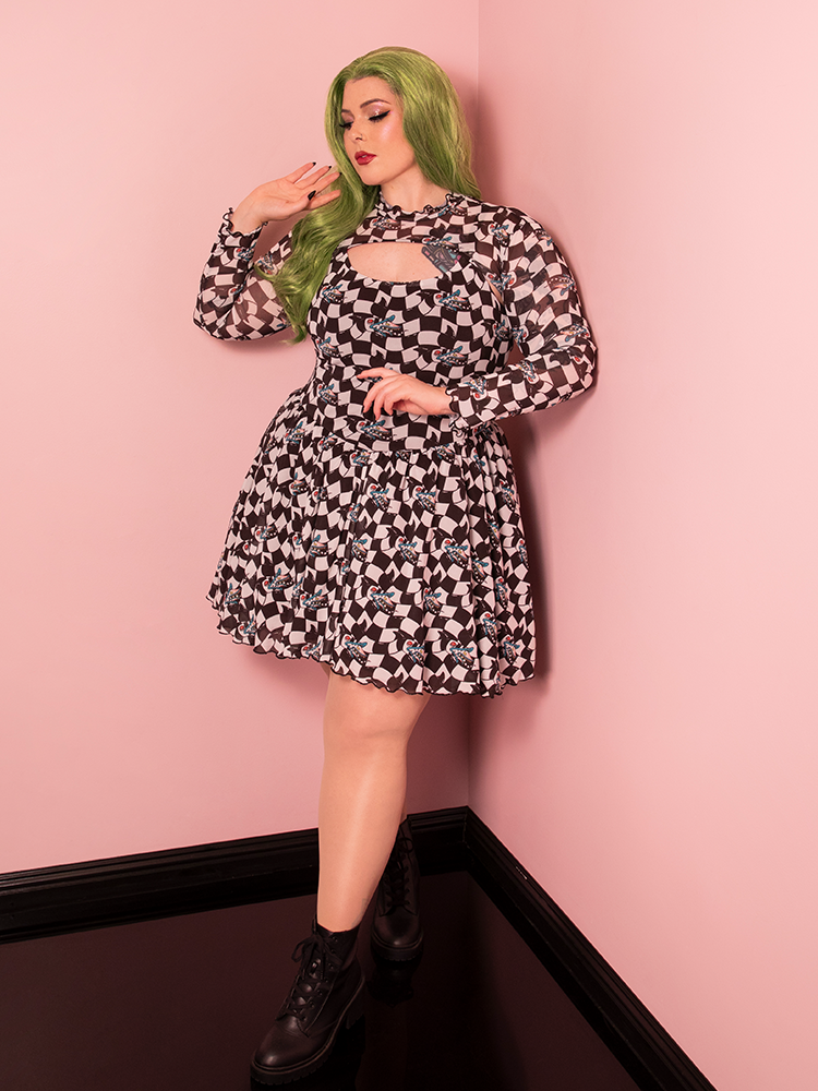 With its bold sandworm print and retro swing silhouette, the Beetlejuice Swing Dress with Bolero is perfect for adding vintage fun to your wardrobe.