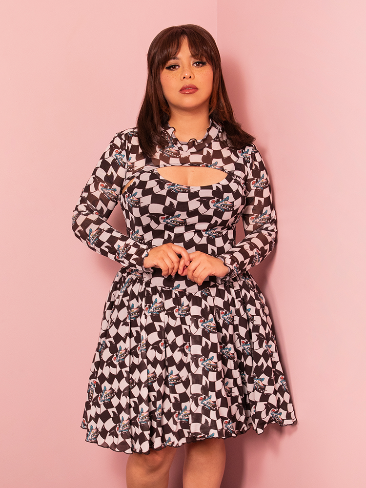 Classic retro meets quirky fun with the Beetlejuice Sandworm Swing Dress and Bolero, combining a whimsical print with timeless vintage style.