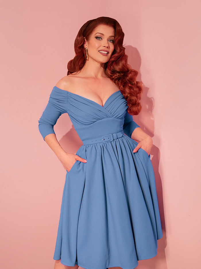 Step into timeless elegance with the Starlet Swing Dress in Sky Blue, a vintage-inspired masterpiece featuring a flattering sweetheart neckline, cinched waist, and full circle skirt. Perfect for capturing the charm of classic Hollywood style with every twirl.

