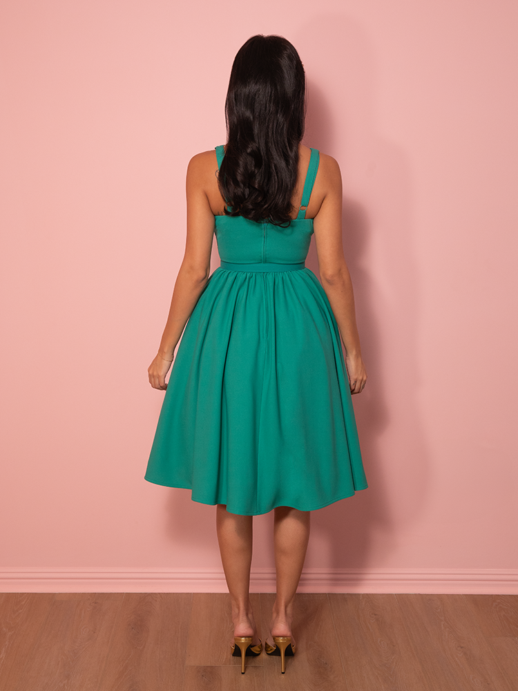 Designed for the modern-day starlet, this teal Ingenue dress blends vintage charm with a structured yet soft silhouette for an unforgettable look.
