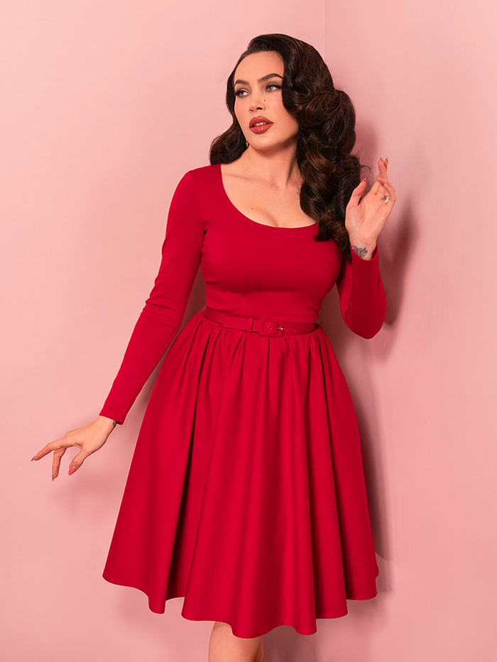 Make a bold entrance with the Troublemaker Swing Dress in Red, a vintage-inspired masterpiece featuring a sweetheart neckline, cinched waist, and a full, flared skirt that channels classic Hollywood glamour.