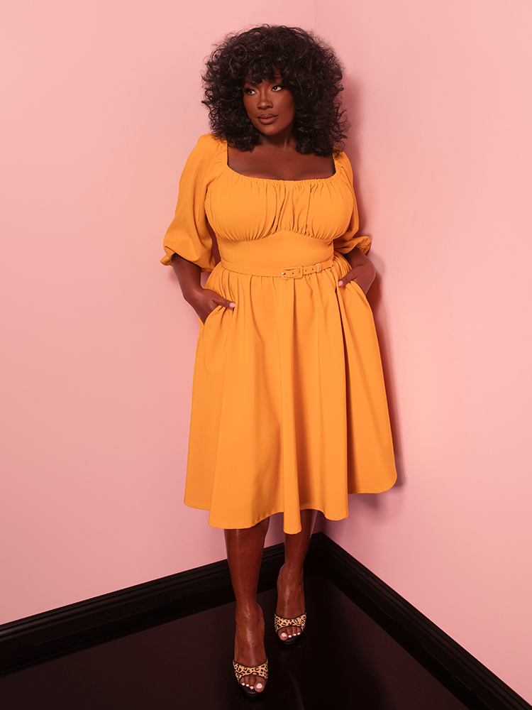 Elevate your casual style with the Vacation Dress in Mustard Gold, a vintage-inspired classic. Its sunny shade and breezy design make it ideal for warm-weather adventures.