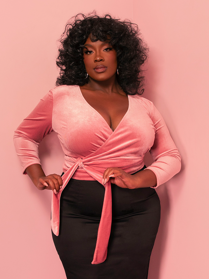 Embrace vintage elegance with this Vixen Pink Velvet Wrap Top, a luxurious piece that highlights timeless femininity. Perfect for pairing with a vintage-inspired pencil skirt or high-waisted trousers for a classic Hollywood vibe.