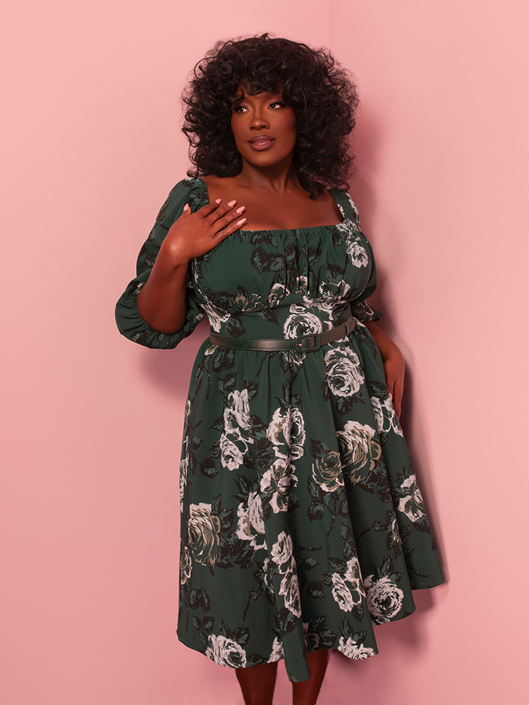 Slip into this vintage-inspired green rose vacation dress and channel retro glamor wherever you wander. The vibrant floral design is a showstopper for any warm-weather outing.