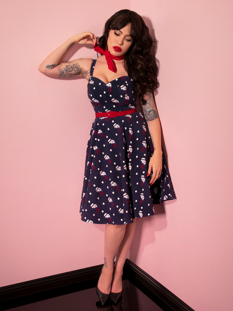 The GHOSTBUSTERS™ Maneater Swing Dress in Stay Puft Novelty Print worn by Micheline Pitt of Vixen Clothing.