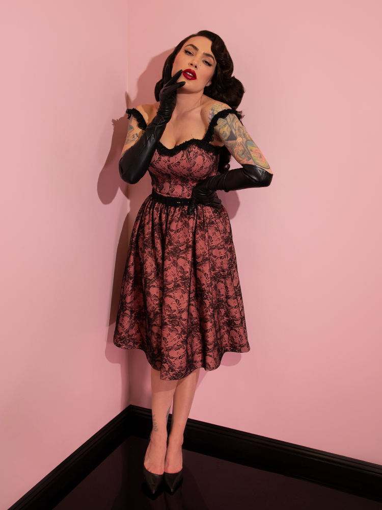 Micheline Pitt seductively showing off the Vacation Swing Skirt in Peach and Black Lace from Vixen Clothing.